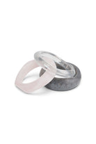 ELSHAM BOUTIQUE Aqua Life set of three resin bangles in translucent clear, soft pink, and marbled grey finishes.