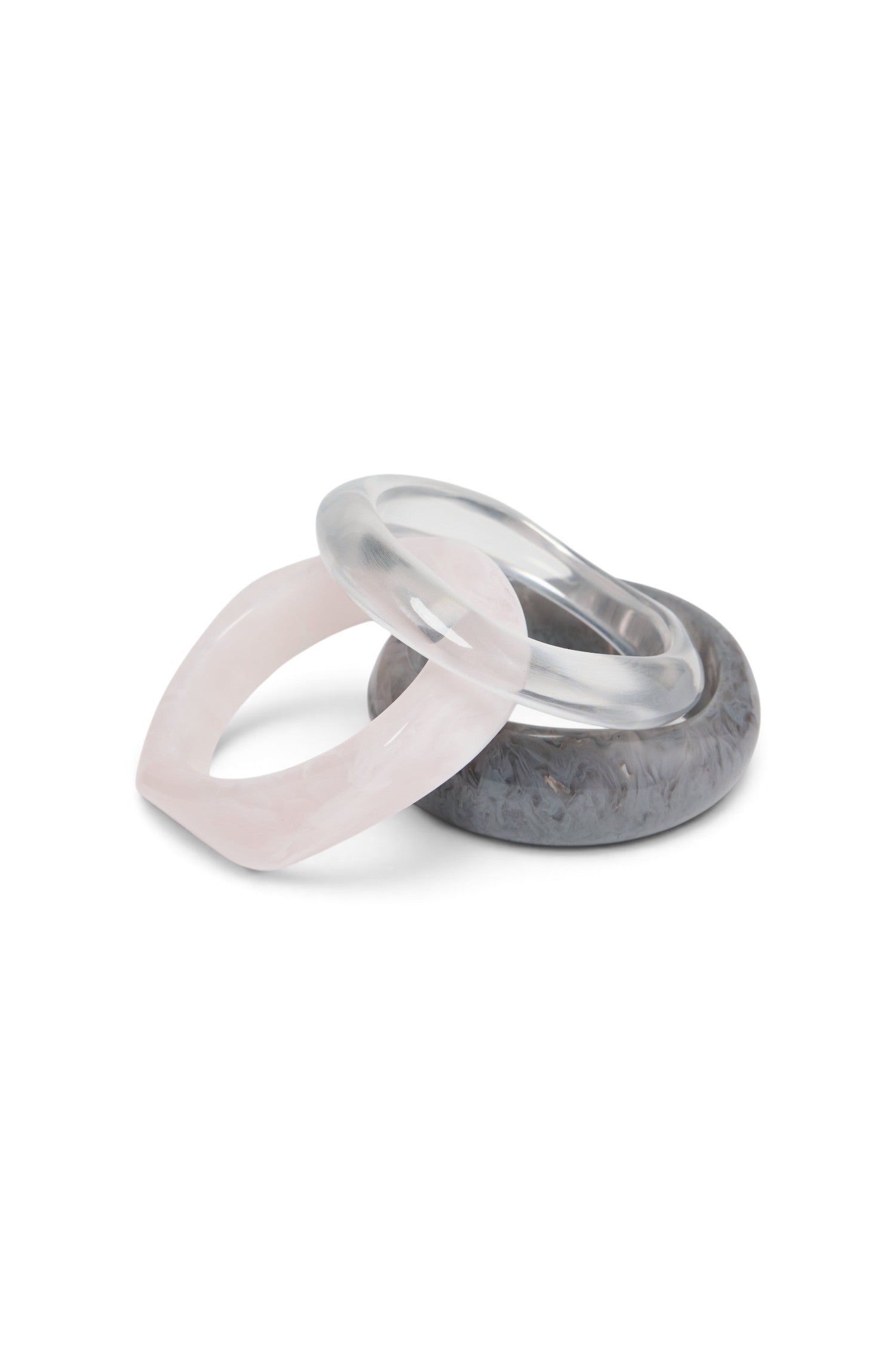 ELSHAM BOUTIQUE Aqua Life set of three resin bangles in translucent clear, soft pink, and marbled grey finishes.