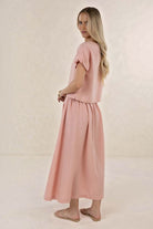 ELSHAM BOUTIQUE Solar Skirt in musk pink linen-tencel blend, featuring an A-line midi silhouette and side pockets.