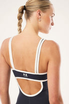 ELSHAM BOUTIQUE Solis playsuit in marine blue and black with a square neck and open back detail