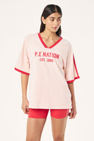 ELSHAM BOUTIQUE Spinout baseball tee in soft pink organic cotton with red contrast binding and front graphic print