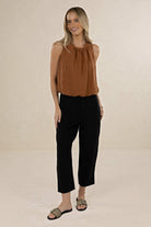 Model wearing ELSHAM BOUTIQUE tobacco linen-tencel sleeveless Samara Top with gathered neckline and elasticated hem