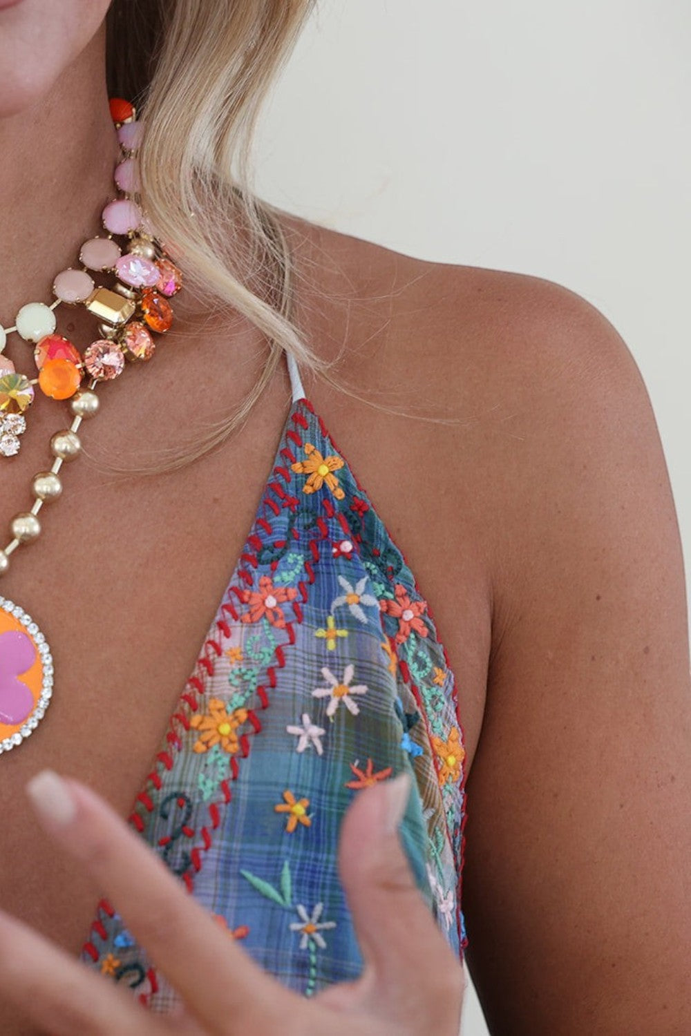 ELSHAM BOUTIQUE Toshka necklace featuring citrus lime and champagne crystals, enamel flower pendant, and gold plating.