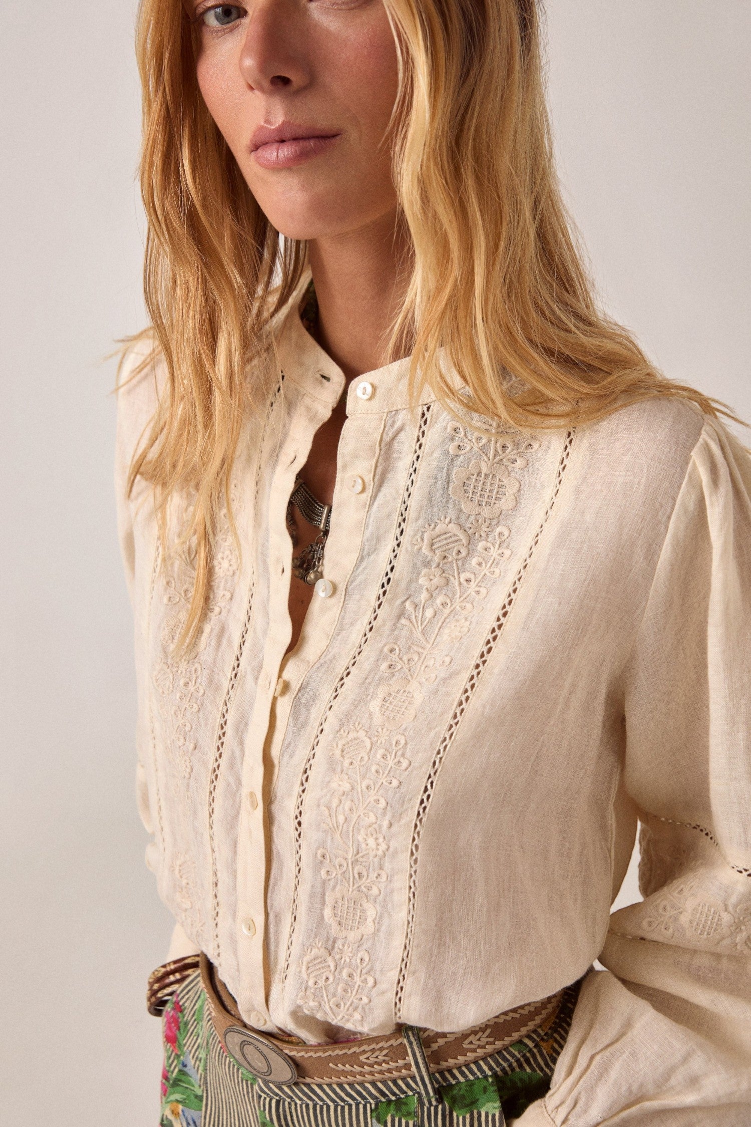 ELSHAM BOUTIQUE whisper white cotton-linen blouse with delicate floral embroidery, button-down front, and long sleeves.