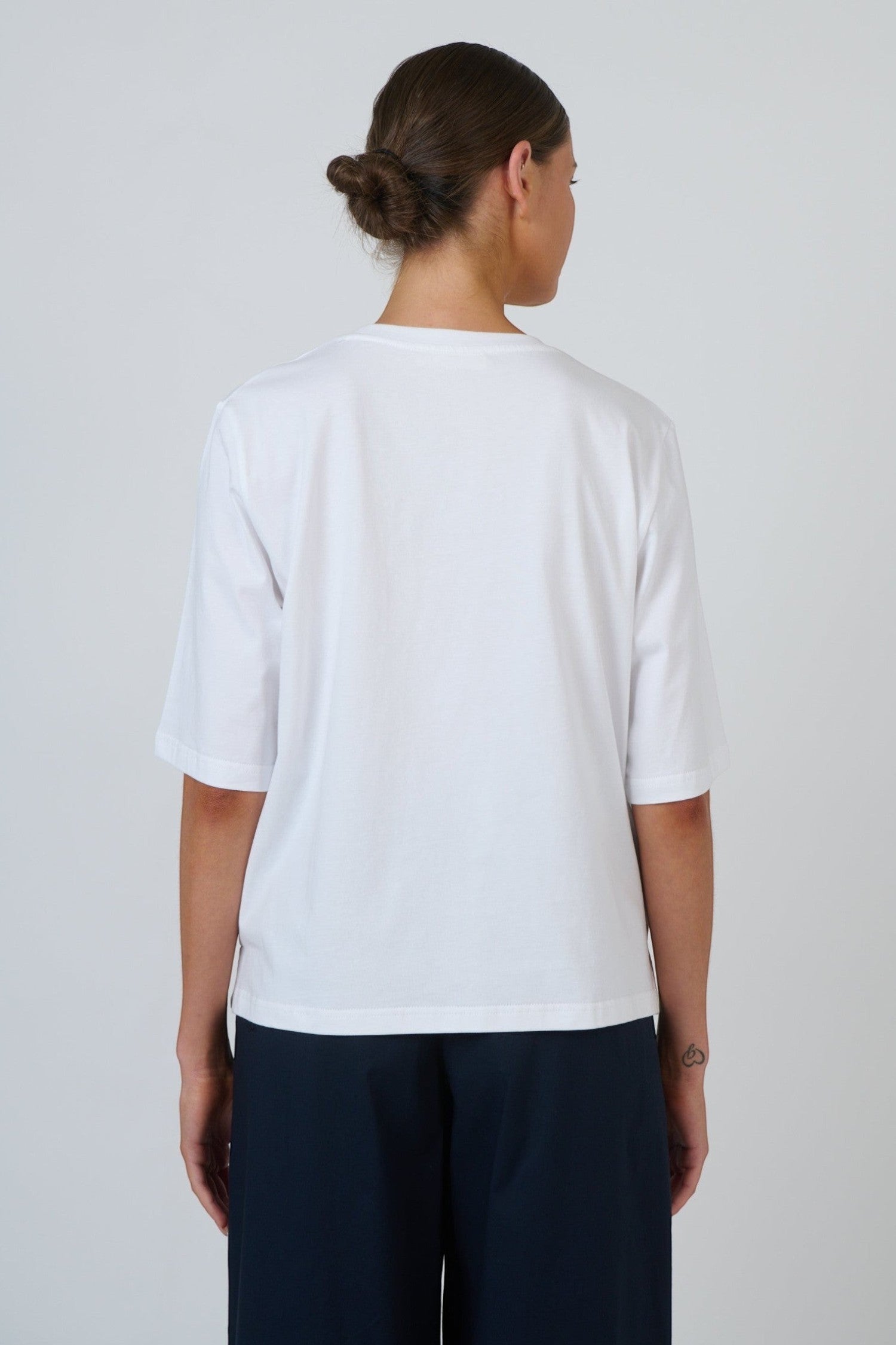 Back view of ELSHAM BOUTIQUE white cotton GA743 crew neck top with drop shoulders and relaxed boxy fit