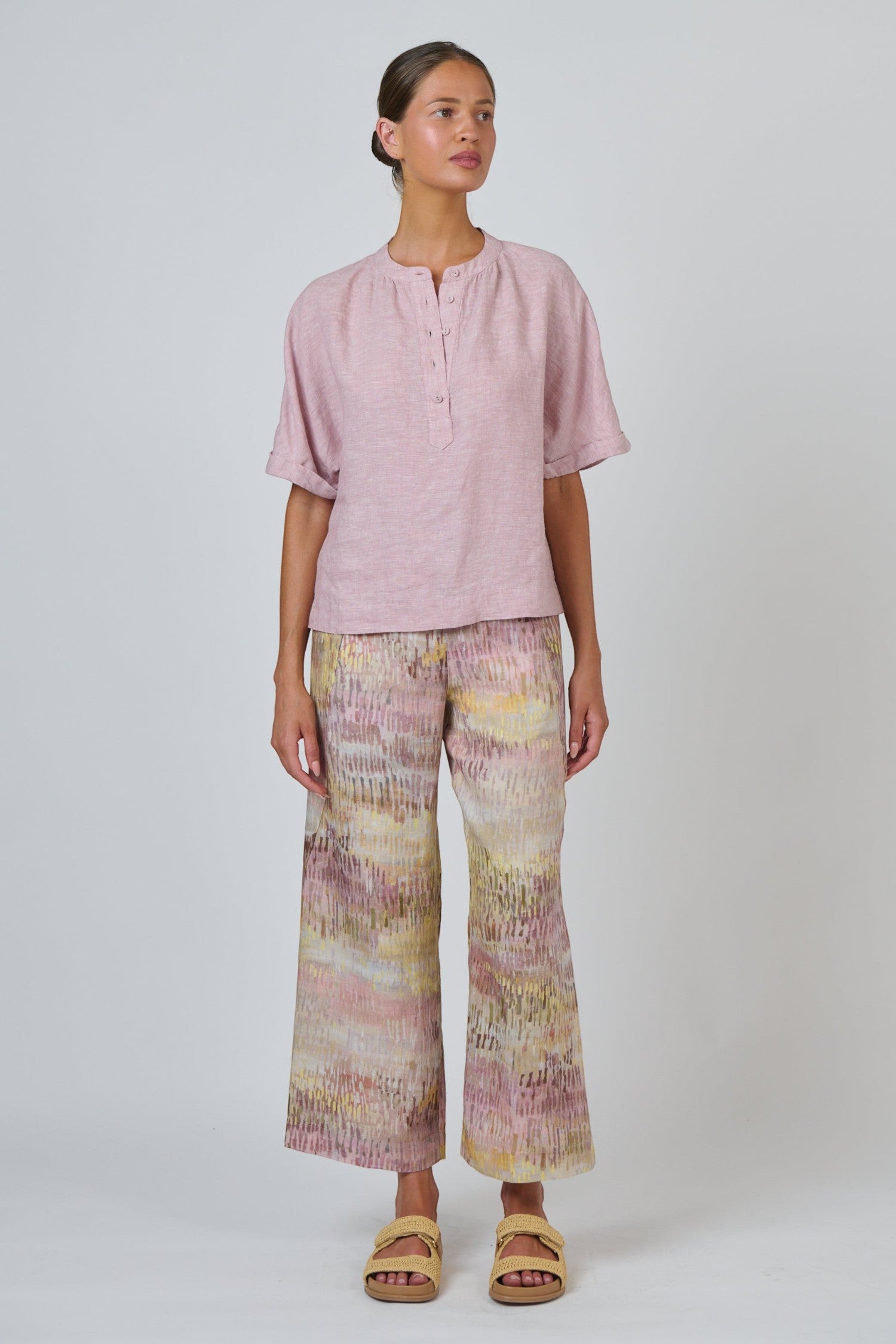ELSHAM BOUTIQUE wide-leg linen trousers in a multi-coloured abstract print paired with a soft pink linen top