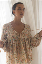 ELSHAM BOUTIQUE Yasmin midi dress in almond print with V-neckline and tiered frill details on a model